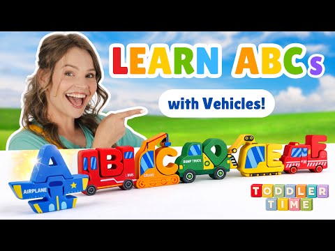 Smiling woman pointing at a row of colorful toy vehicles forming the ABCs in a bright outdoor scene, for a kids' learning video.
