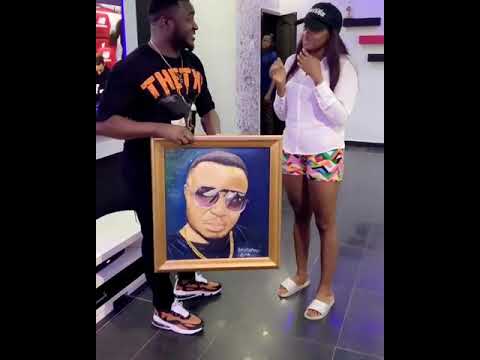 Cindy gifts MC Galaxy a portrait for making her a millionaire