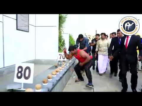 124 Coconuts Smashed with Hand in a Minute