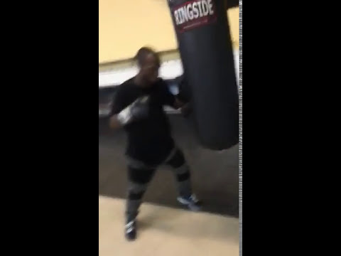 Boxer training on heavy bag