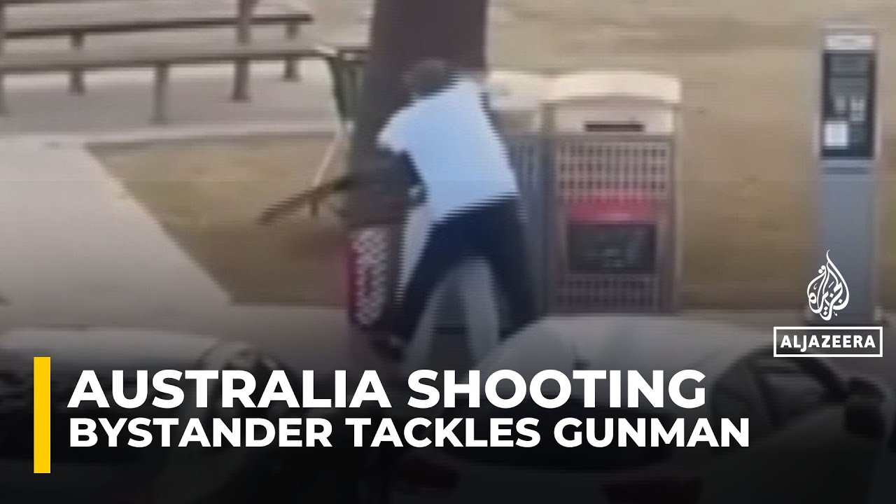 Video shows bystander tackling one of the shooters at Sydney’s Bondi Beach