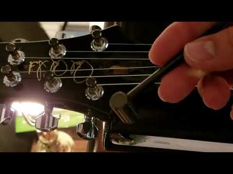 How to adjust a TOP adjustable truss rod and stop fret buzz