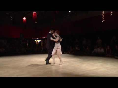  Sebastian Jimenez  and  Joana Gomes  are  dancing  to  "  Adoración  "  by  Rodolfo Biagi  at  Tango Roots  in  2016