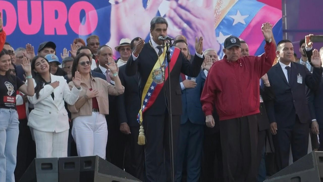 Maduro celebrates third term in office with supporters outside Miraflores presidential palace | AFP