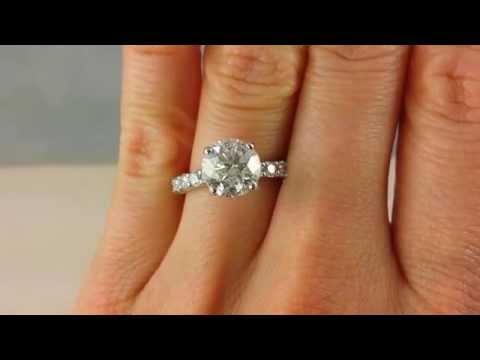 2.66 ctw with a sparkly 2.16 Round Cut H Color SI3 (L) Clarity Center Diamond