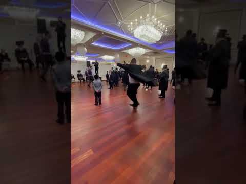 Shulem Fisher dancing at a wedding