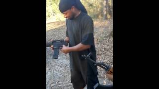 The black rambo showing off his gunplay