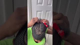 Braiding my hair in a swoop ponytail