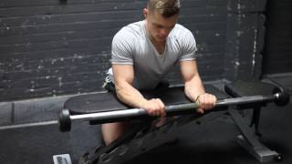 Palms Down Barbell Wrist Curl Over Bench exercise video thumbnail