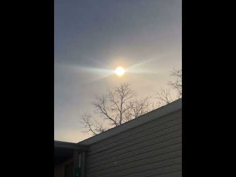 Solar eclipse. If you look closely, you can see something come out the sun.