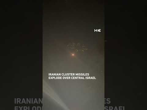 Iranian cluster missiles explode over central Israel amid exchange of fire with Iran