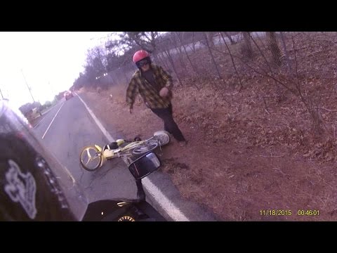 Drunk guy fights biker over tipped moped Video