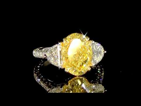 GIA Certified 5.16ct Oval Brilliant Cut Fancy Yellow Diamond Ring