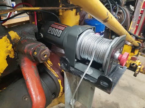Harbor Freight 2000 lb. winch on International 140 Tractor. Woods Belly Mower Lift