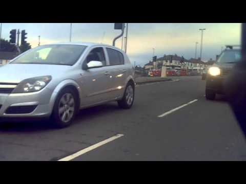 LD57NJN   4x4 driven by a 2x4; tailgating, inept MGIF squeeze, for the red light