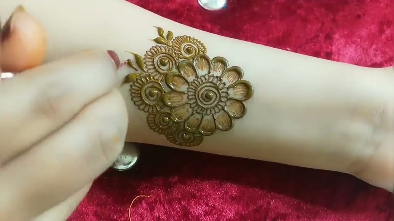 floral arabic mehndi design for front hand by tais mehndi designs