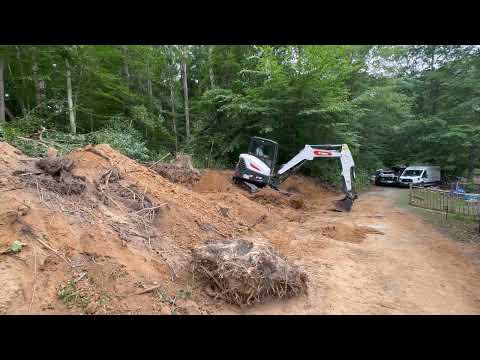 Removing a large stump with a Bobcat E48