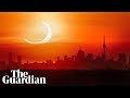 Solar eclipse 2021: crescent sun wows skygazers across northern hemisphere