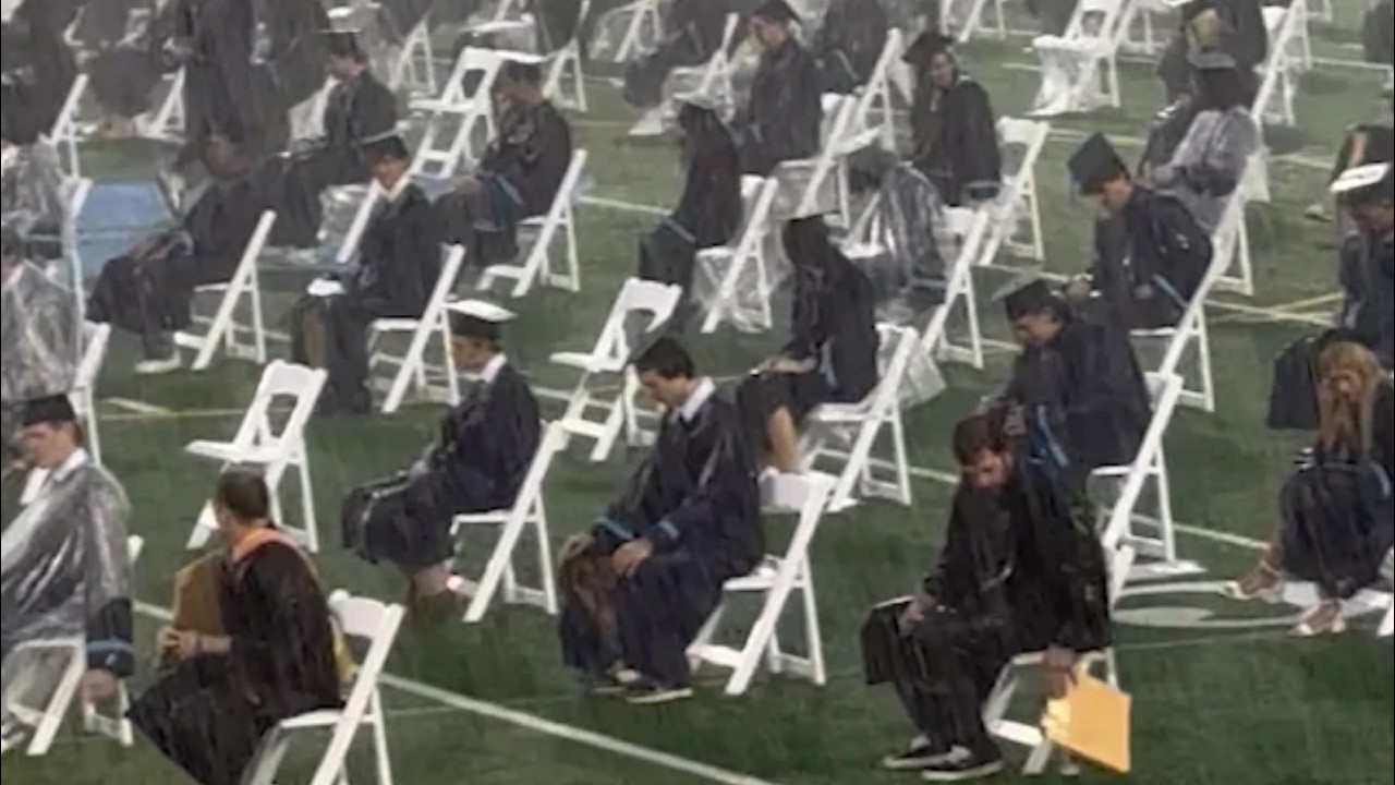 Dystopian Outdoor Graduation in Heavy Downpour || ViralHog