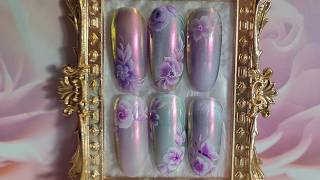 Effective chrome cat eye nail art & one stroke flowers using gel polish and angular nail art brush.