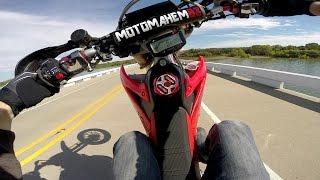 Supermoto Rides One Mile Long Wheelie Over Lake Bridge