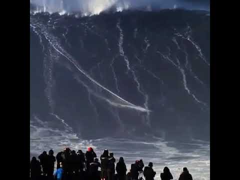 Guy surfing 100 foot tall wave