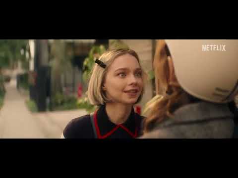 Trailer frame of school and field action underscored by indie and alt-rock cues