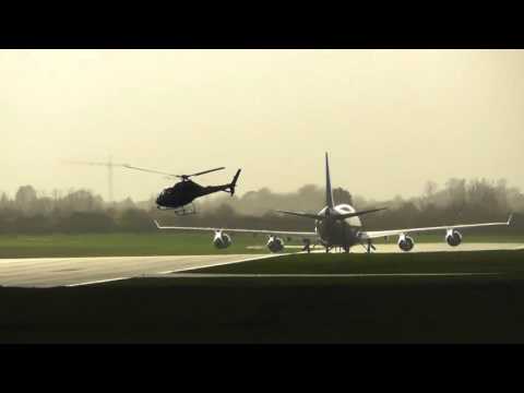 Helicopter takes off past 747 16nov15 Cambridge UK 241p