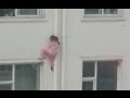 Man's Quick Thinking Saves Girl Dangling from Building in Shanxi Man's Quick Thinking Saves Girl Dangling from Building in Shanxi