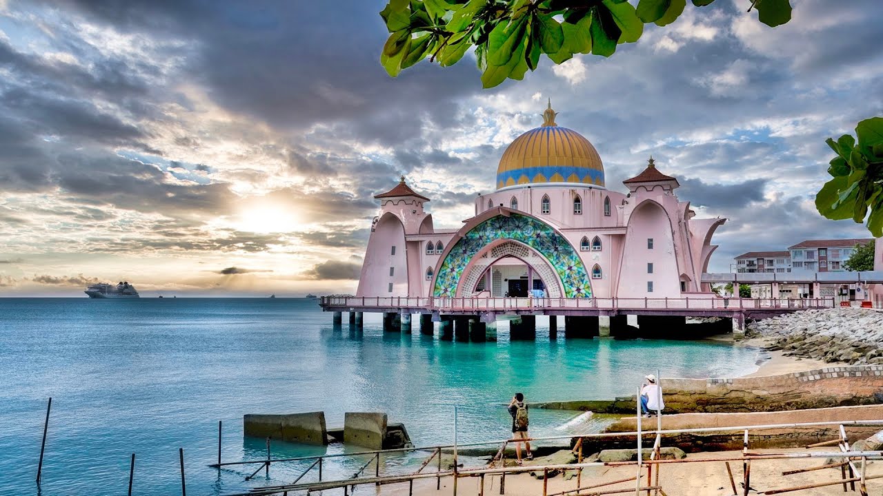 Embark on an engaging walking tour of the majestic Masjid Selat Malacca.