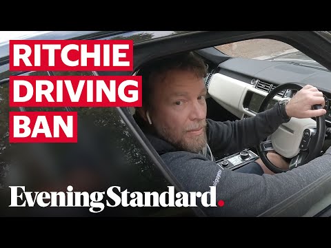 Moment Guy Ritchie is caught texting at the wheel in Hyde Park