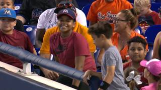 KC@MIA: Fan catches two foul balls in one at-bat