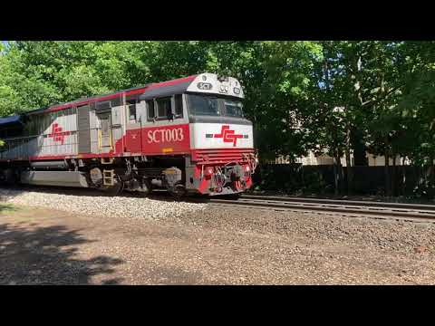 SCT Freight Train on a Down Hill run thru Aldgate in the Adelaide Hills on its way to Melbourne .