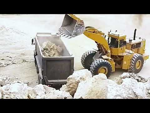 quarry work limestone loading volvo dumper caterpillar loader 980G and 988B