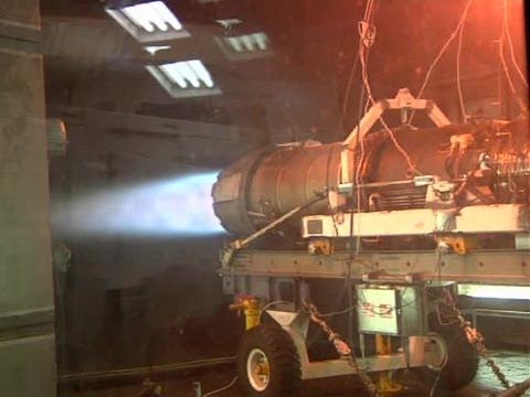 Aviation Machinist's Mate Working on F-18 Jet Engines