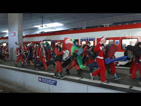 Video | Hundreds dressed as Santa take to the slopes in Switzerland | AFP