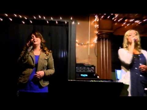 Kerri Hardwick and Amanda Parsons singing at The Well Coffeehouse