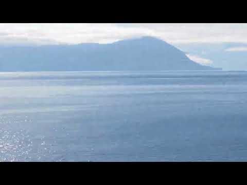 Thumbnail for Ruby princess cruise in Alaska passing by other Cruise ship and gorgeous reflection of Sun on water
