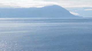 Ruby princess cruise in Alaska passing by other Cruise ship and gorgeous reflection of Sun on water
