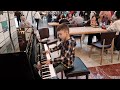 Michele 8 years old play Einaudi - Nuvole Bianche on a public piano in a shopping center #music