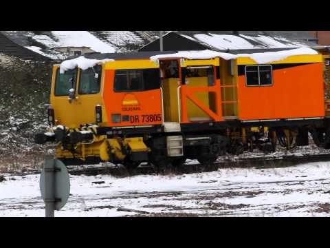 Colas Rail Tamper DR 73805 sit in snow on Horton Road Depot Gloucester