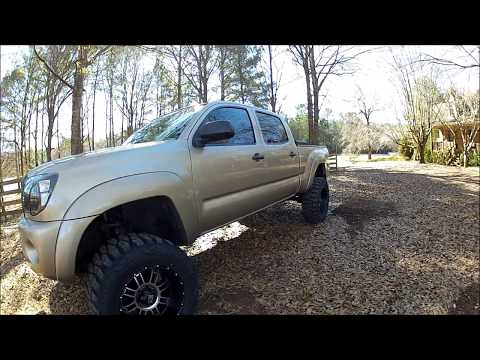 20" xd riots and mudgrapplers on lifted tacoma