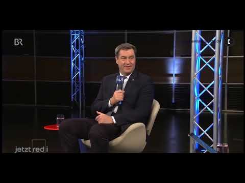 Söder Versprecher? Verräter? Verquatscht? Genau hinhören! „[..]Masken die man mach..nehmen muss[..]“