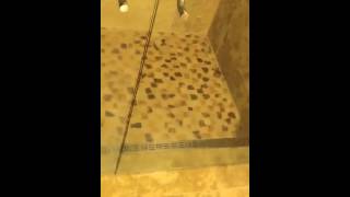Curbless travertine shower Curbless travertine shower