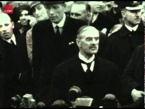 Neville Chamberlain returns from Germany with the Munich Agreement