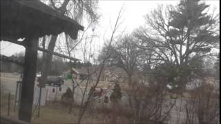 white pick up truck racing in front of St  Gabriels hospital and Emblom Funeral home Little Falls Mn