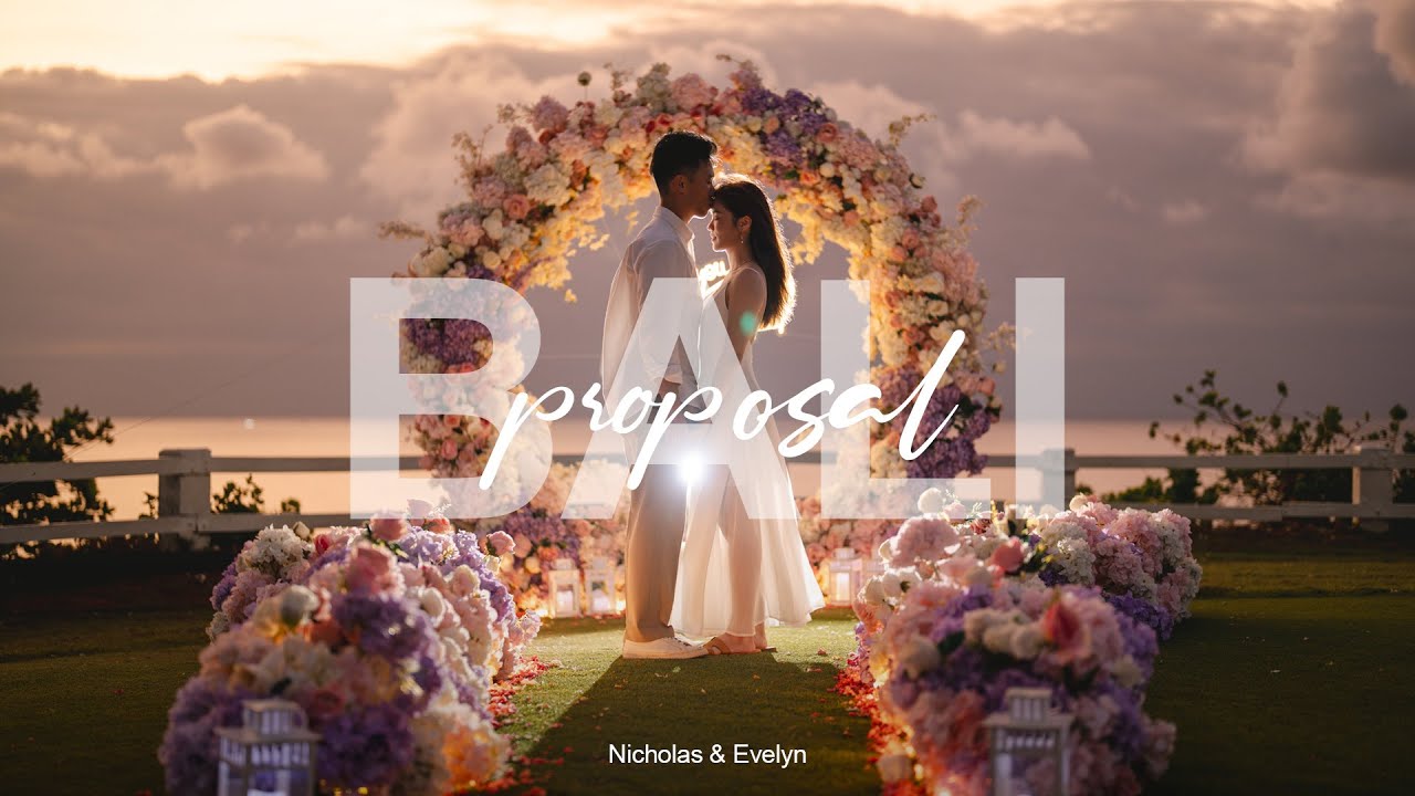 Video thumbnail: Nicholas and Evelyn, couple under a flower arch at sunset