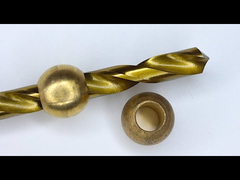 Drilling a perfect hole through a sphere using a simple homemade tool