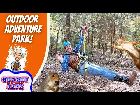 Man in helmet and harness ziplining through a forest, with an orange 'Outdoor Adventure Park' banner and playful squirrels nearby.
