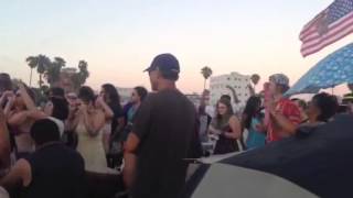 Sunset drum gathering on Venice Beach, California